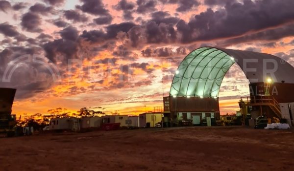 Fabric building mine site sunset